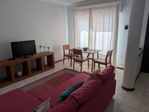 a living room with a couch and a table at Apartamento Espargos in Espargos