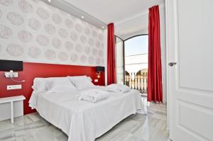 Ein Bett oder Betten in einem Zimmer der Unterkunft The Zentral Arenal Suites
