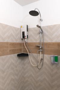 a shower with a shower head in a bathroom at IBIZA BEACH Resort in Haad Yao +126 photos