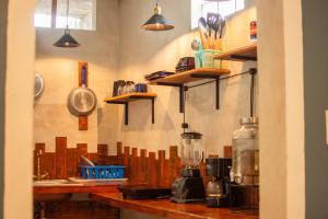a kitchen with a counter with a blender on it at Casa X'Lapac in Valladolid