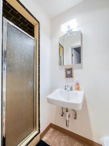 a bathroom with a sink and a shower at The Nest with Firepit & Backyard Oasis in Klamath Falls +32 photos