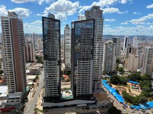 two tall buildings in a city at Lounge 22 barato 12e13agosto in Goiânia