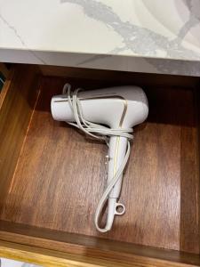 a white wii controller in a drawer at Ruca Lodge - Luxury Container Tiny Home Surrounded by Nature in Uvita