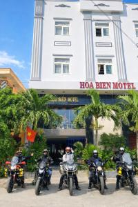 a group of motorcycles parked in front of a hotel at Hoa Bien Motel in Ly Son +16 photos