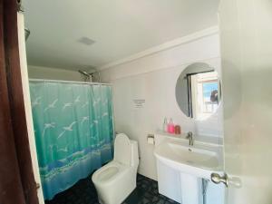 a bathroom with a toilet and a sink and a mirror at Paradise view A7-Kantiang paradise resort- in Ko Bu Bu