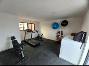 a room with a bed and some exercise equipment at Flat Azzure 205 in Cabedelo