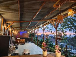 a restaurant with a view of the mountains at VANY Glamping in Pasuruan +16 photos