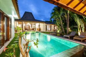 a swimming pool in the backyard of a villa at 3BDR Villa with Pool Jacuzzi - Canggu in Dalung