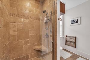 a bathroom with a shower with a glass door at Moore on Main in Abingdon +35 photos