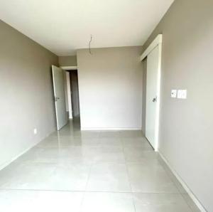 an empty room with white walls and white tile floors at Apto 204 in Barcarena