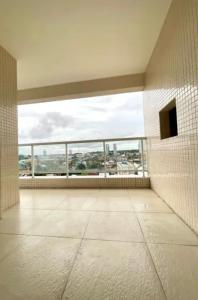 an empty room with a large window in a building at Apto 204 in Barcarena