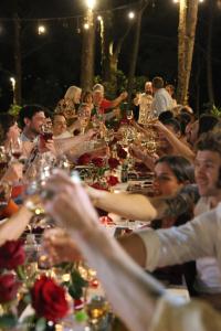 a large group of people sitting at a long table at Amaya Retreat in Sóc Sơn