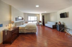 Voodi või voodid majutusasutuse Hotel LP Columbus toas