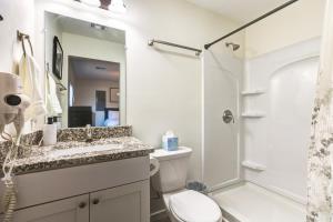 a bathroom with a sink and a toilet and a shower at Stylish New Construction Home in Salina +13 photos