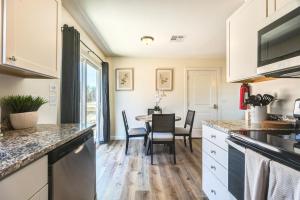 a kitchen and dining room with a table and chairs at Stylish New Construction Home in Salina