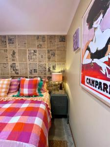 a bedroom with a bed and a poster on the wall at Lydiard General Cafe Delight in Ballarat