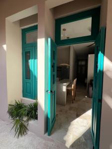 a door to a room with a table and a dining room at T'uut' Hotel in El Cuyo