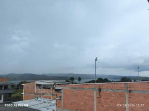 arial view of a brick building with a city at Habitación de Lujo para Pareja in Darién