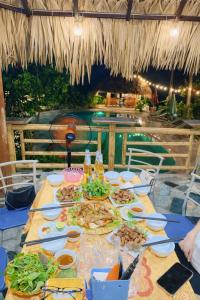 a table with plates of food on top at Trang An Lighthouse Homestay in Ninh Binh +45 photos