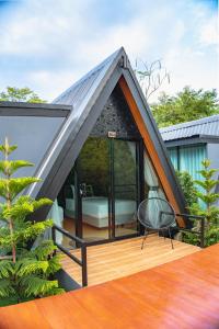 a gazebo with a bed on a deck at The View A-Frame Cabin in Chiang Dao +9 photos