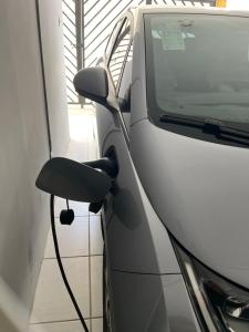 a white car parked next to a side view at Duplex premium com garagem perto do centro 5 hósp. in Garanhuns