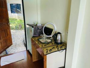 a mirror sitting on a counter with a sink at Paradise view A5 -Kantiang paradise resort- in Ko Bu Bu