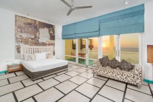a bedroom with a bed and a couch at Hotel J Negombo in Negombo +51 photos