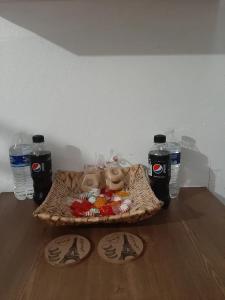 a table with bottles of water and shoes on the floor at Nice apartment in the north in Hermosillo