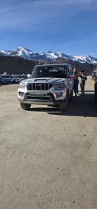 a silver truck is parked in a parking lot at Sedan cab car four wheel jeep in Pokhara