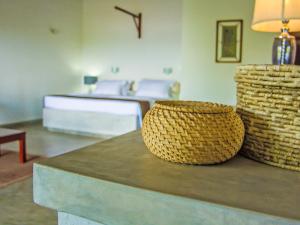 two baskets sitting on a counter in a room at The Lagoon Villa in Negombo +17 photos