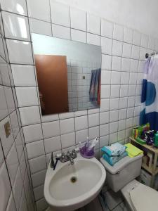 a bathroom with a sink and a mirror and a toilet at Palm Beach 278 in Palm-Eagle Beach