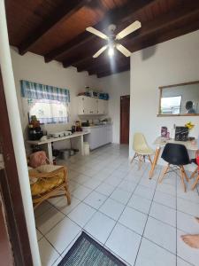 a living room with a table and a kitchen at Palm Beach 278 in Palm-Eagle Beach
