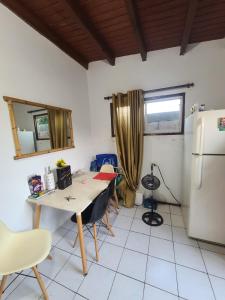a kitchen with a table and a refrigerator at Palm Beach 278 in Palm-Eagle Beach +10 photos