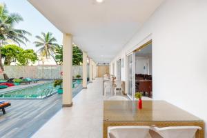 an open floor plan of a villa with a swimming pool at Hotel J Negombo in Negombo