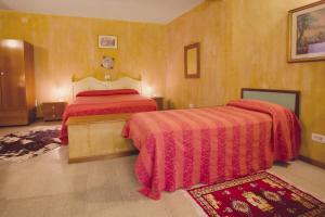 Postel nebo postele na pokoji v ubytování Hotel Centrale + 18 fotografií