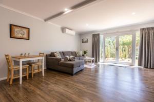a living room with a couch and a table at Topp House Retreat in Bethany