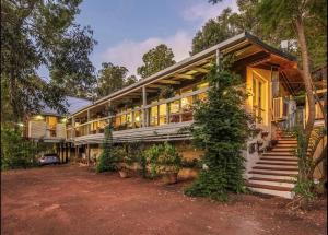 an exterior view of a house with trees at Bickley Tree Stay in Bickley