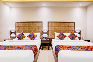 FabHotel Abrol Suites 객실 침대