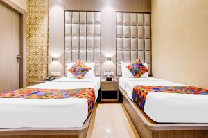 FabHotel Abrol Suites 객실 침대