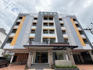 a large building with a sign on the front of it at Indigo Hotel Hatyai 2 Khet 8 in Sathani Hat Yai