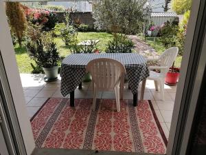 a table and chairs sitting on a patio at Chantilly in Orvault