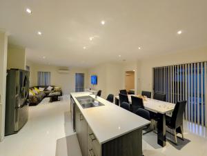 a kitchen and living room with a couch at Grand stay in Perth