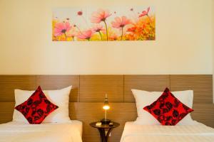 Ένα ή περισσότερα κρεβάτια σε δωμάτιο στο Smile Hotel