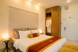 Ένα ή περισσότερα κρεβάτια σε δωμάτιο στο Smile Hotel