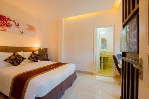Ένα ή περισσότερα κρεβάτια σε δωμάτιο στο Smile Hotel