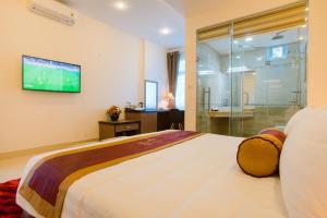 Ένα ή περισσότερα κρεβάτια σε δωμάτιο στο Smile Hotel
