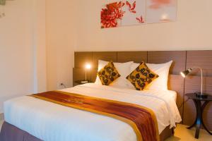 Ένα ή περισσότερα κρεβάτια σε δωμάτιο στο Smile Hotel