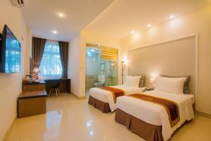 Ένα ή περισσότερα κρεβάτια σε δωμάτιο στο Smile Hotel
