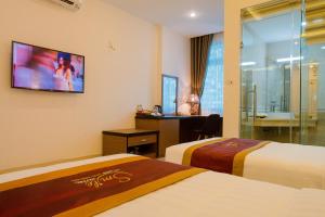 Ένα ή περισσότερα κρεβάτια σε δωμάτιο στο Smile Hotel