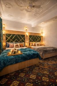 a hotel room with two beds in a room at Lake side stays in Srinagar
